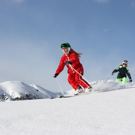 ski instructor with child Saalbach