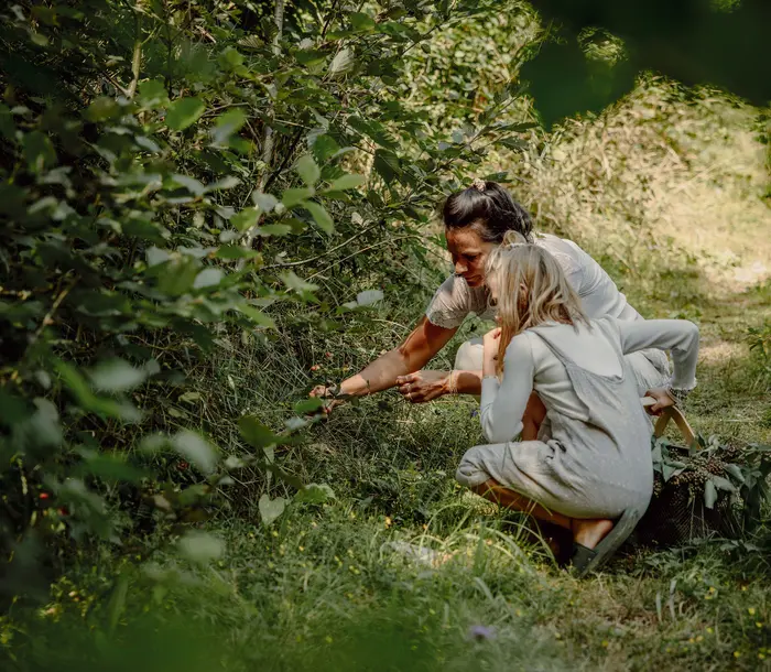 Mother with daughter in the forest