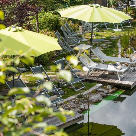 relax by the swimming pond in the garden hotel